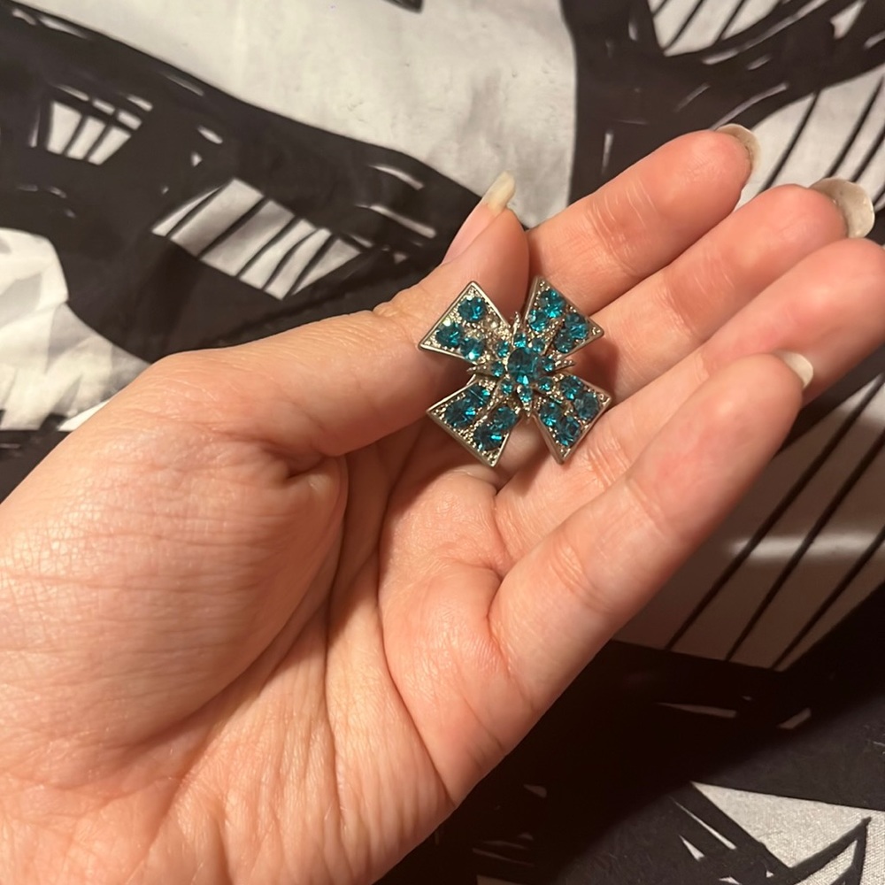 Silver ring with blue diamonds